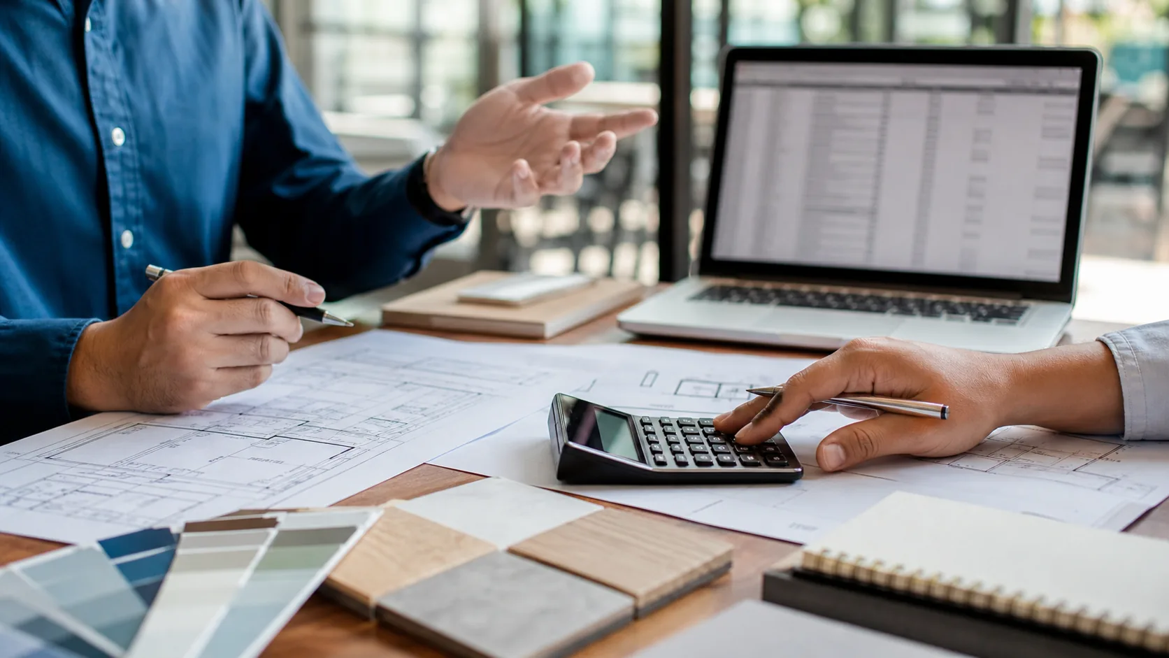 Commercial project budget planning with finish samples and construction documents.